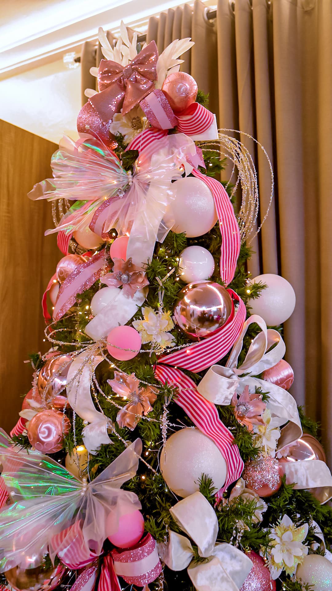 Full view of a blush pink and white styled tree with rose gold accents